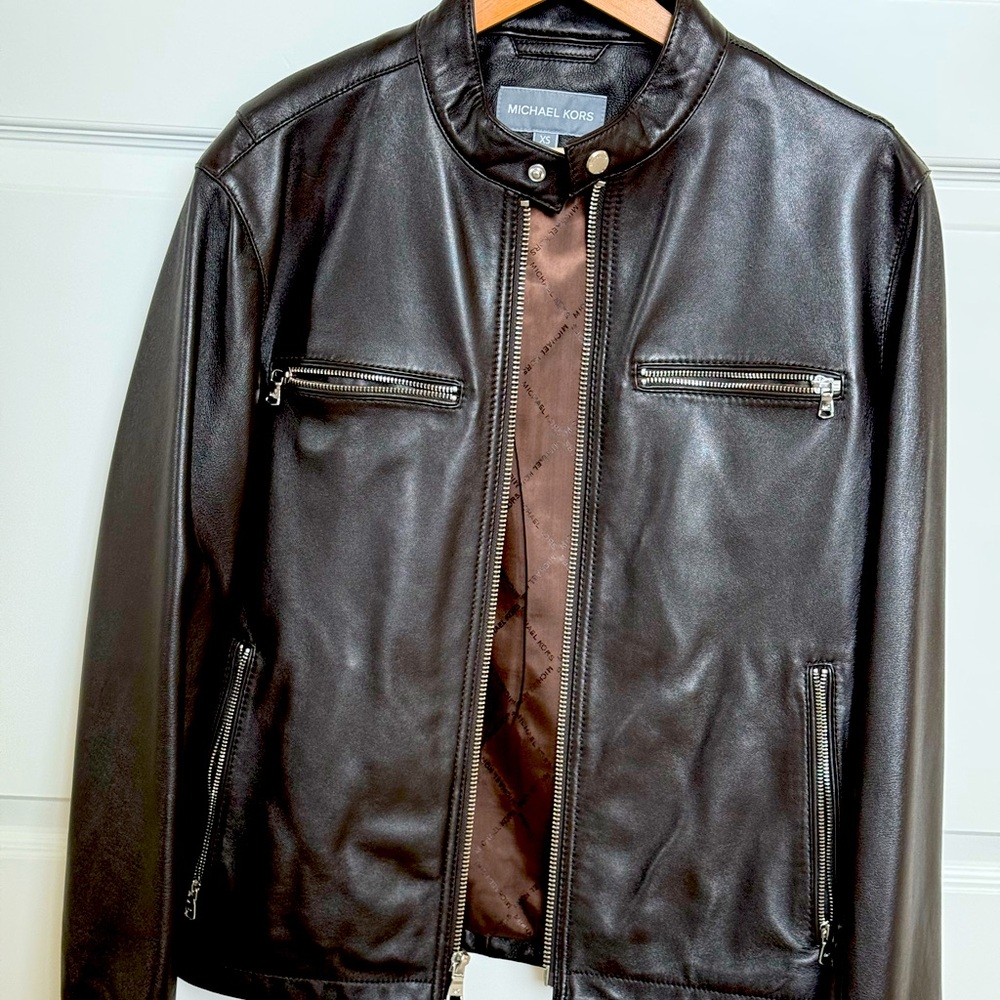 New Michael kors leather jacket, never worn and is in my closet for 6months.